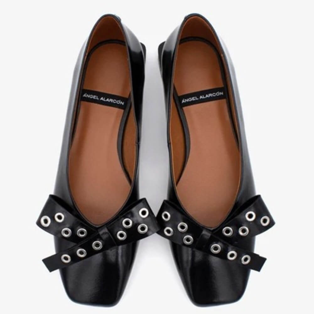 Black pointed-toe flats with silver embellishments and a black bow Ángel Alarcón Adelia 25504 Flat Leather Shoe-BLACK