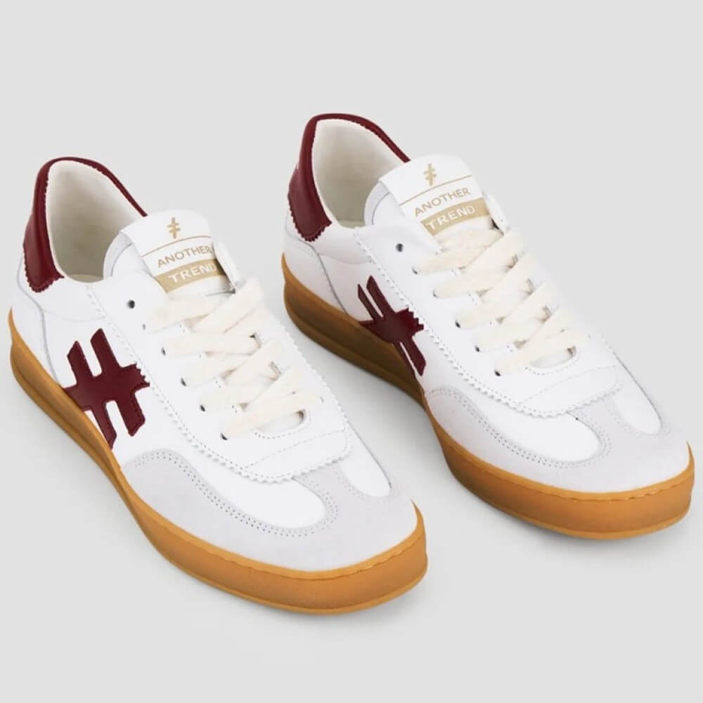 White sneaker with red logo and brown sole on a light gray background Another Trend Leather Sneakers A032-WHITE RED
