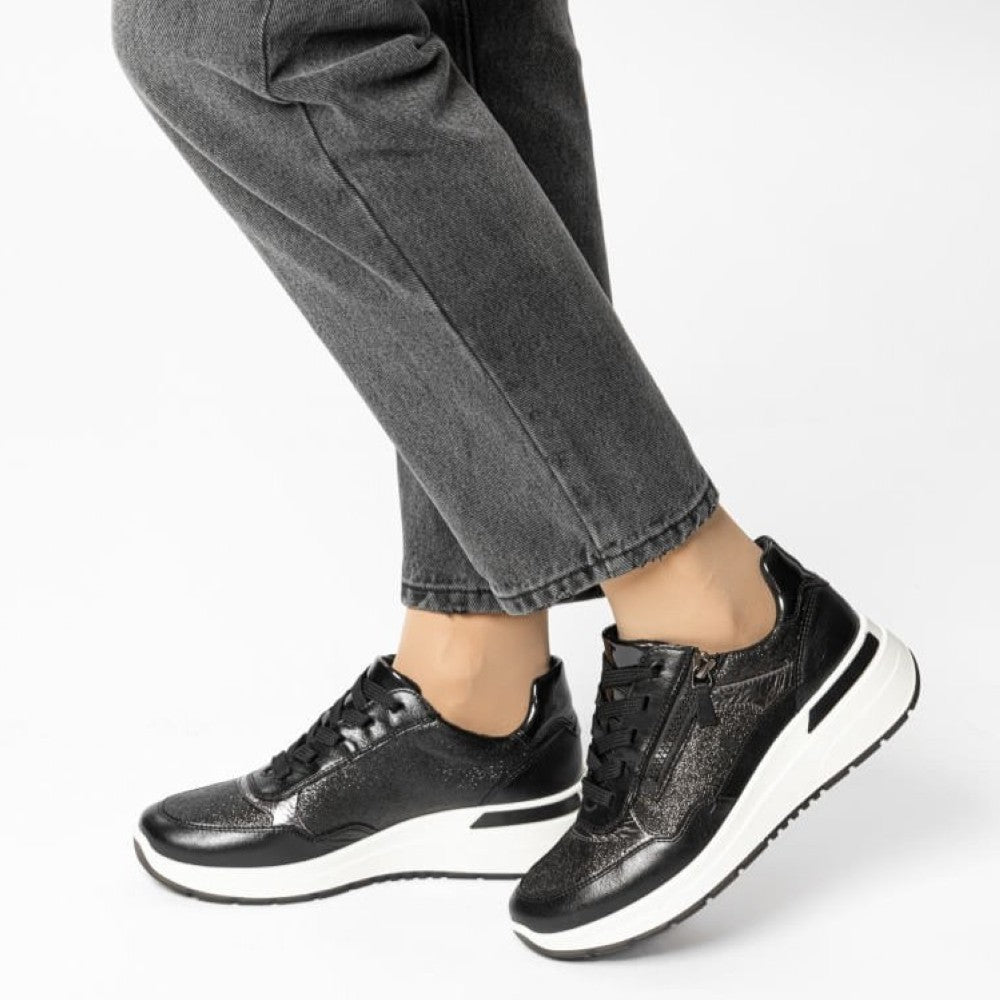 Black and silver sneaker with a thick wedge white sole on a white background Ara Garda Wedge Trainers 12-57702 H Fit