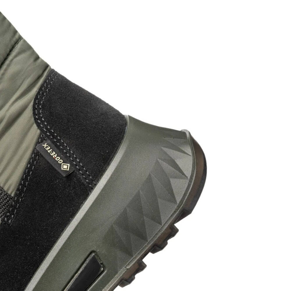 Close-up of a green and black boot with a brand logo on a white background