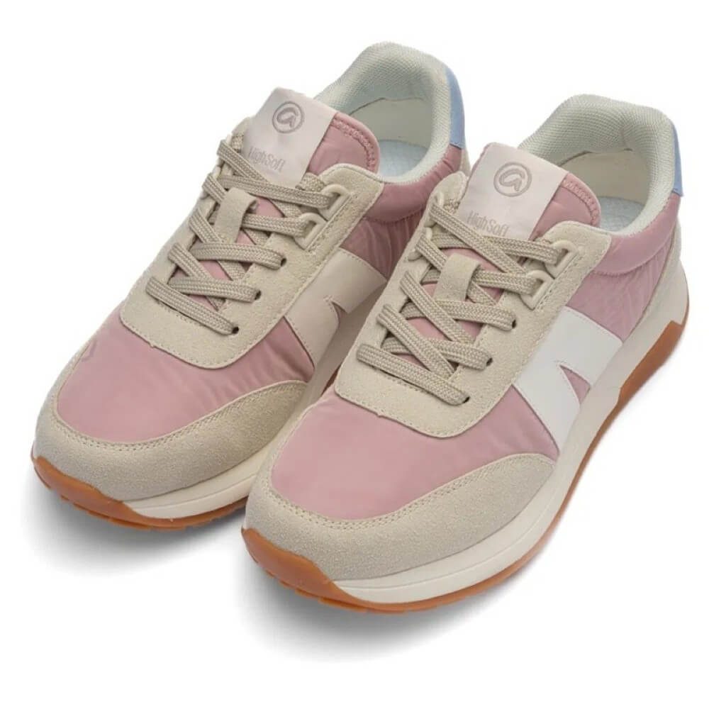Pink and beige sneakers with brown soles on a white background
