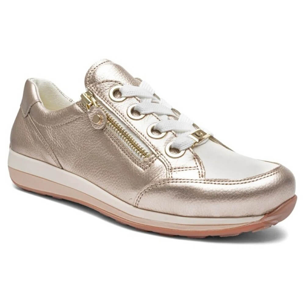 Gold sneaker with white laces on a white background