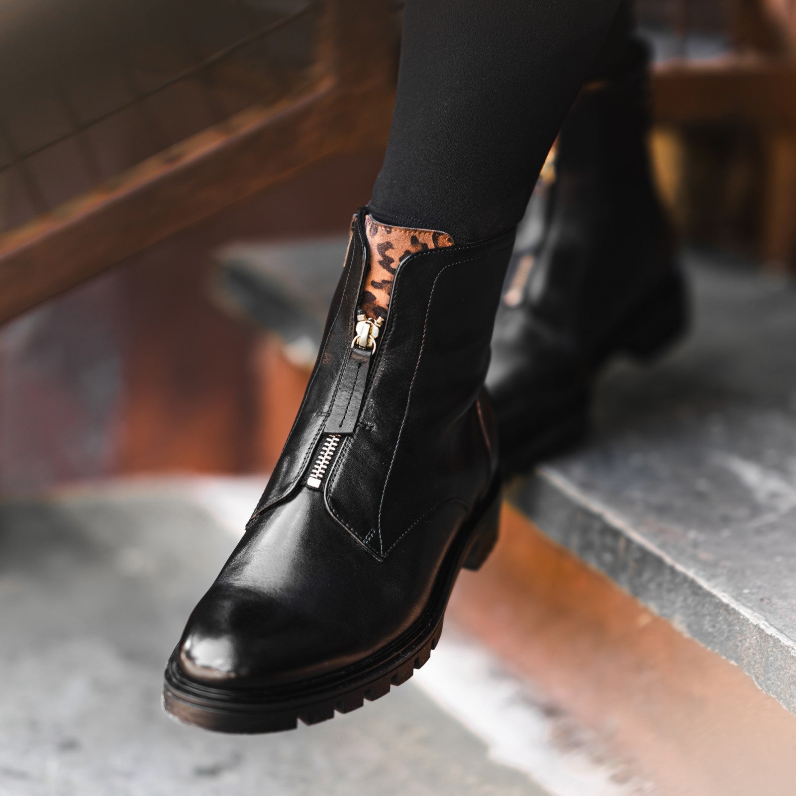 Black leather boot with leopard print detail on a blurred background Ara Tulsa ST Ankle Boot 12-29520 ARA-BLACK