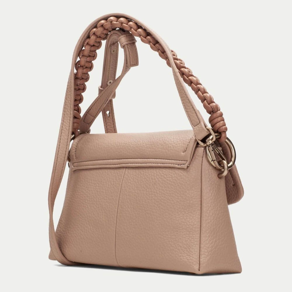 Hispanitas Beige handbag with braided handle on a light grey background