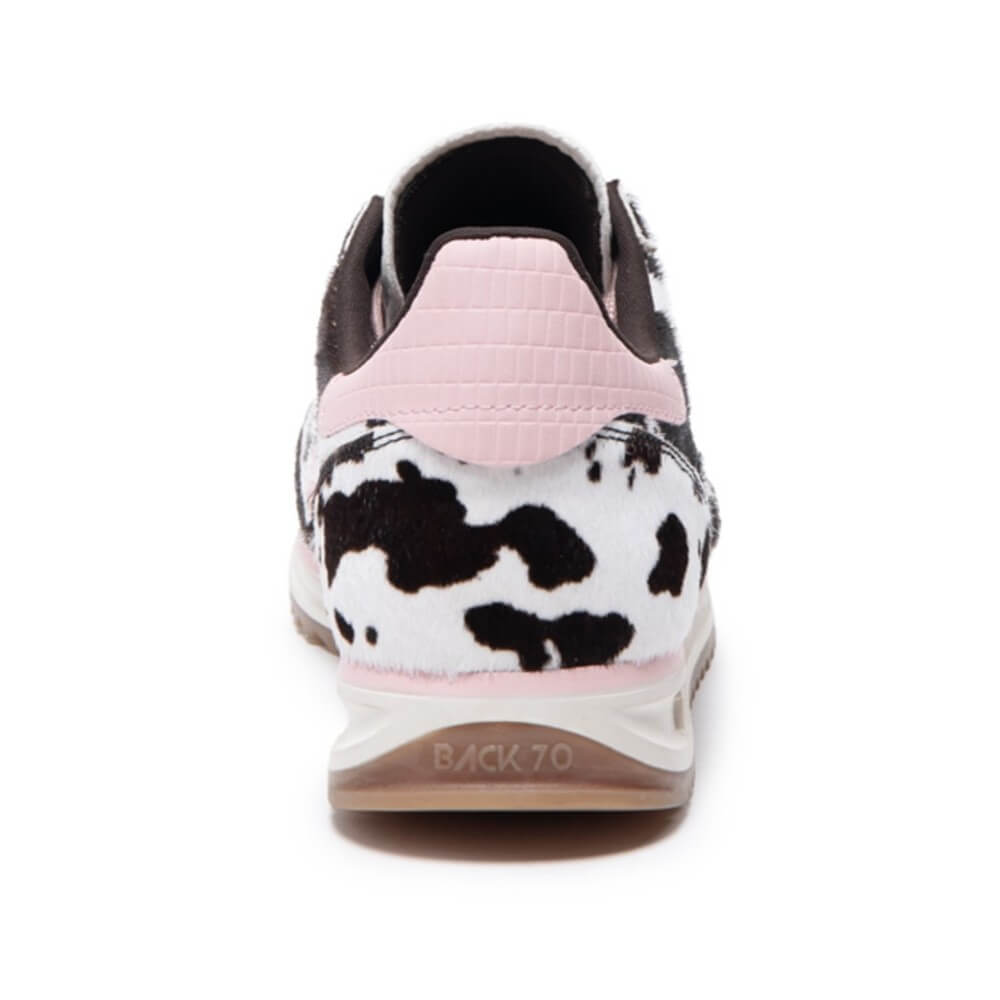 Sneaker with cow print pattern on a white background Back 70 Jogger Cow Pink L51 Crafted from soft pony hair leather in a striking cow print