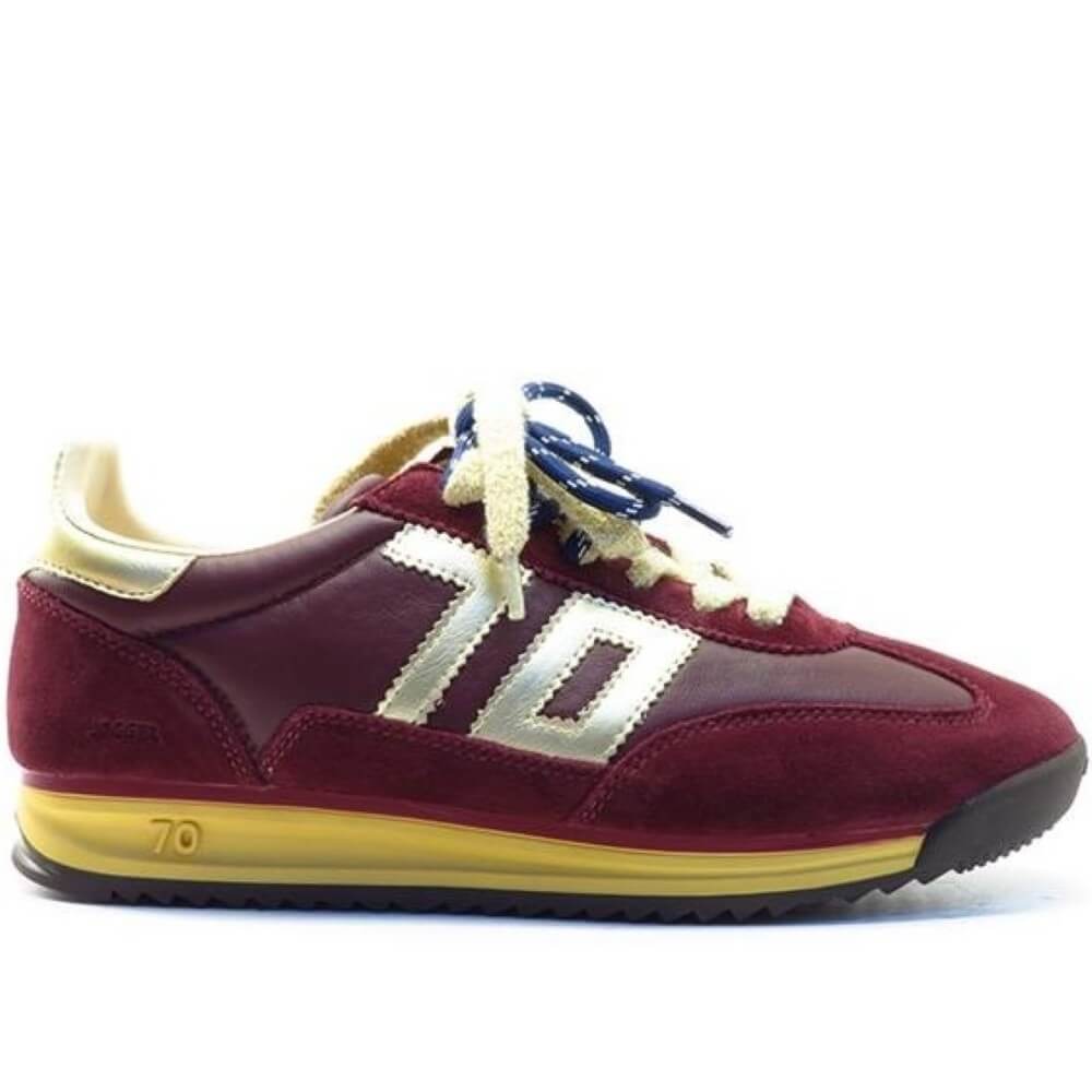 A low-top sneaker in burgundy suede and leather, featuring a prominent cream-colored 'Back 70' logo on the side, cream laces, a yellow midsole, and blue laces threaded through the eyelets, set against a plain white background.