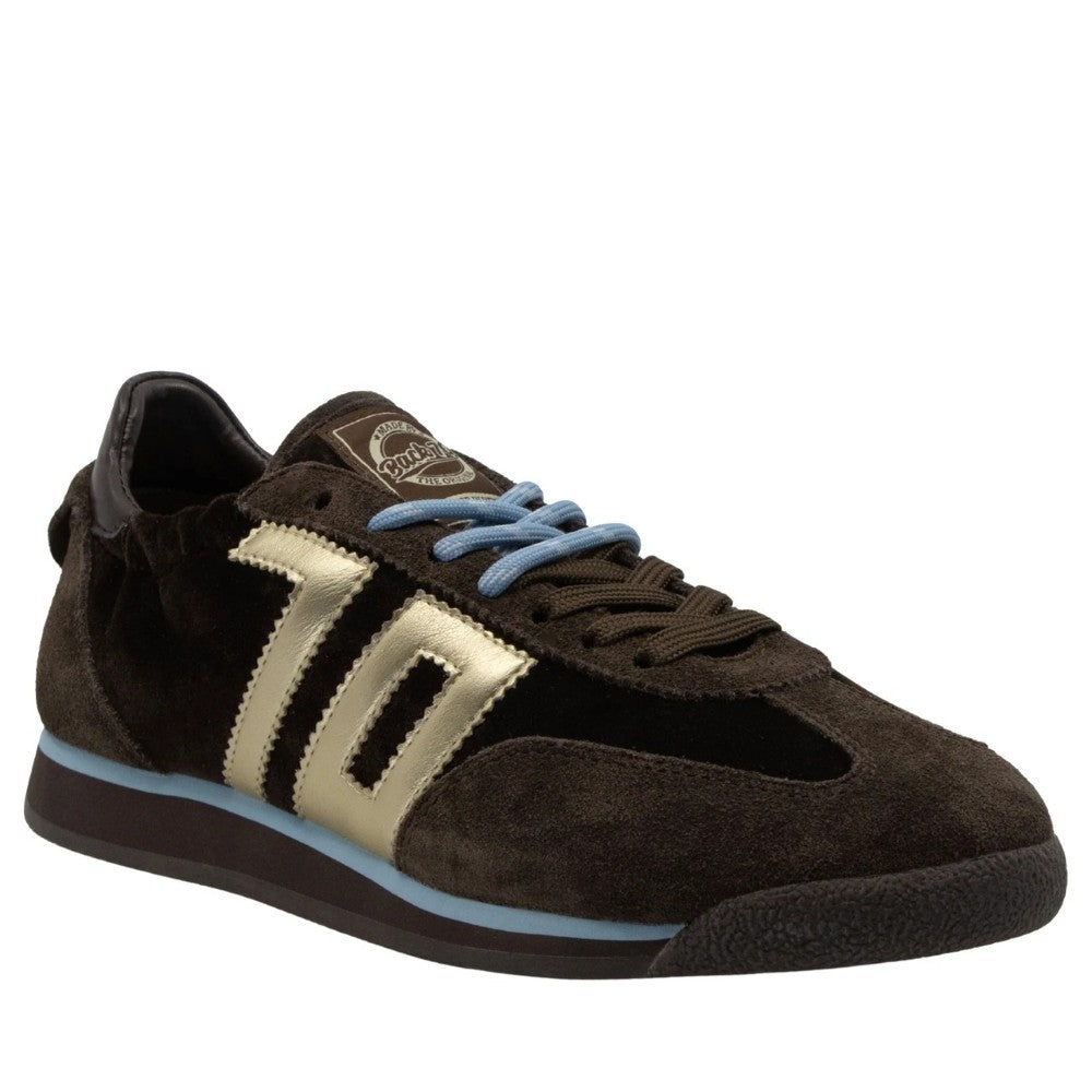 A Back 70 dark brown suede sneaker with metallic gold side stripes, light blue laces, and a light blue accent line on the sole, shown against a plain white background.
