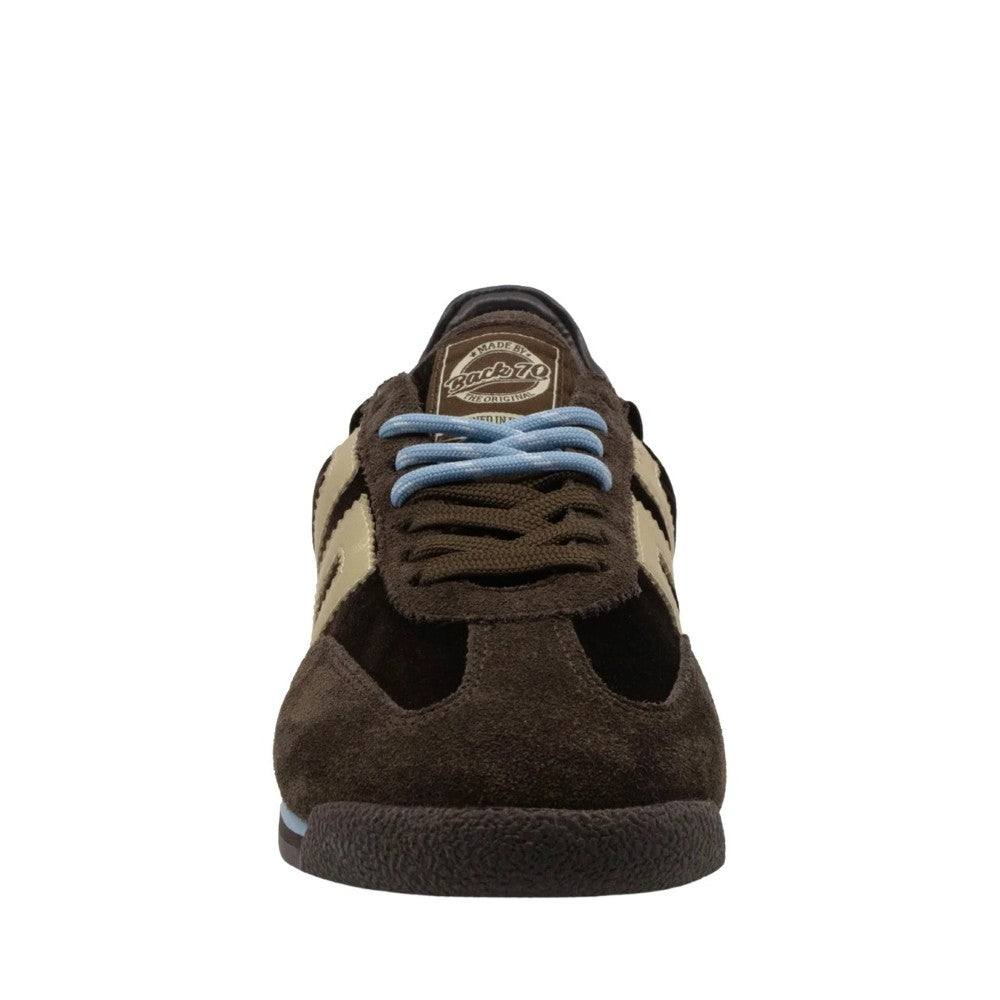 A single low-top sneaker shown from the front on a plain white background. The shoe features a dark brown suede and mesh upper with beige side stripes, light blue laces, and a dark brown sole.