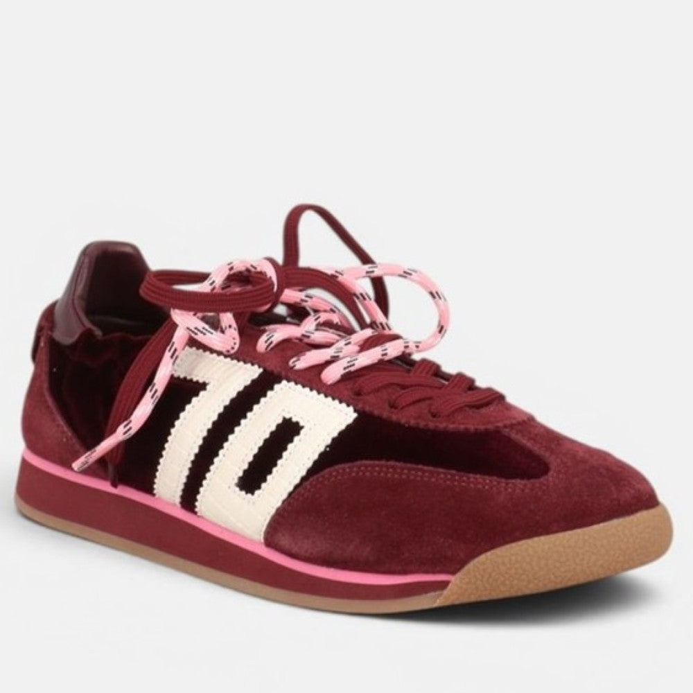 A Back 70 low-top sneaker in burgundy Velvet and suede with a textured cream side stripe, pink patterned laces, and a gum sole, shown against a light grey background.