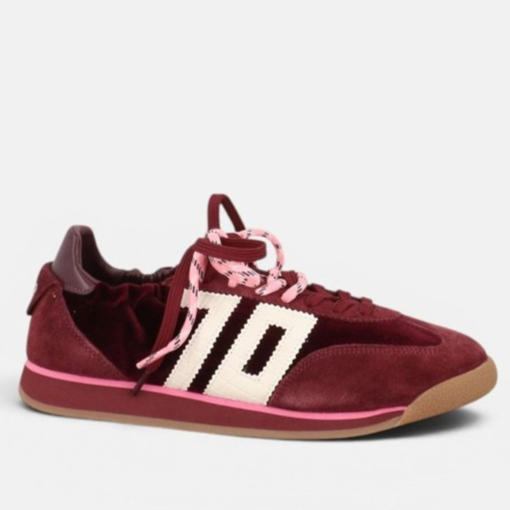 A Back 70 low-top sneaker in burgundy Velvet and suede with a textured cream side stripe, pink patterned laces, and a gum sole, shown against a light grey background.