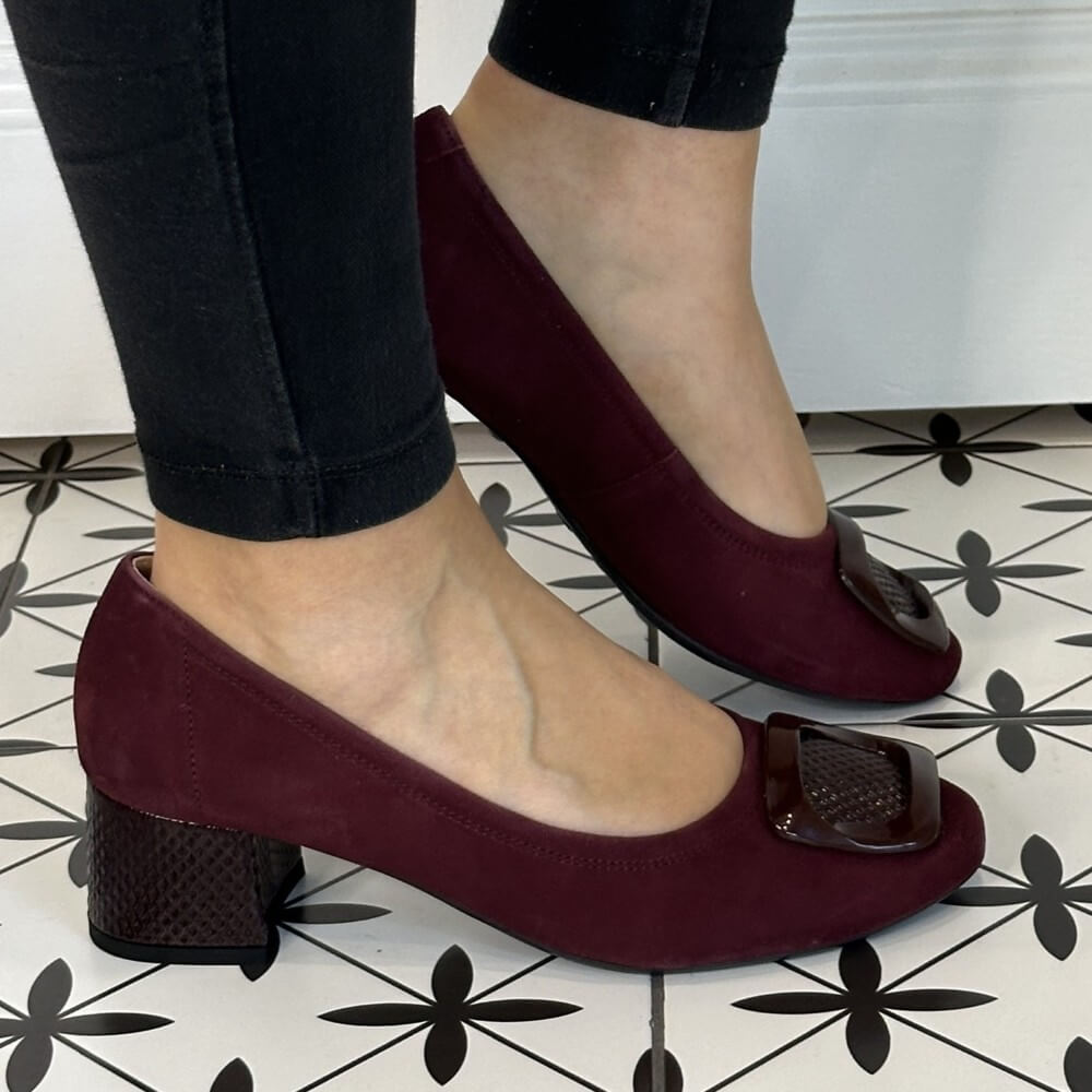 Burgundy shoes with a block heel worn by a person on a patterned floor. Bioeco 6883 H Fit Block Heel Burgundy Suede