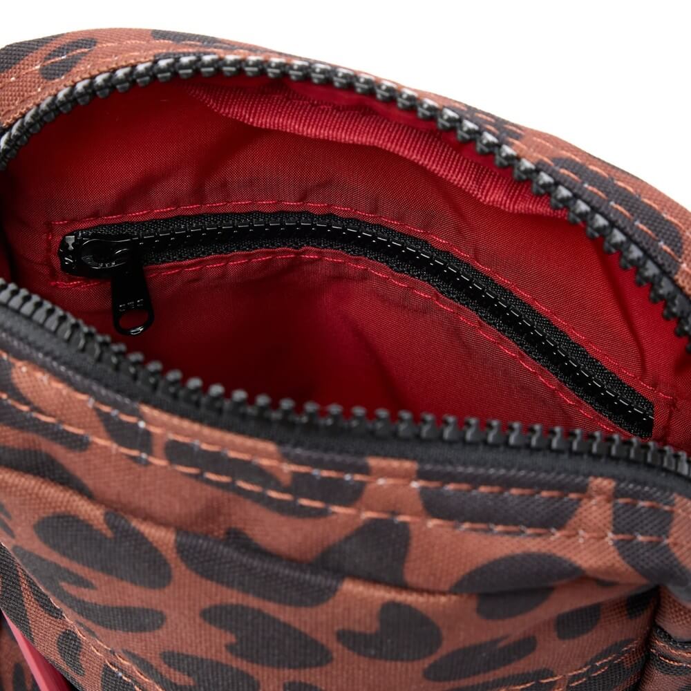 Leopard print bag with red interior and black zipper