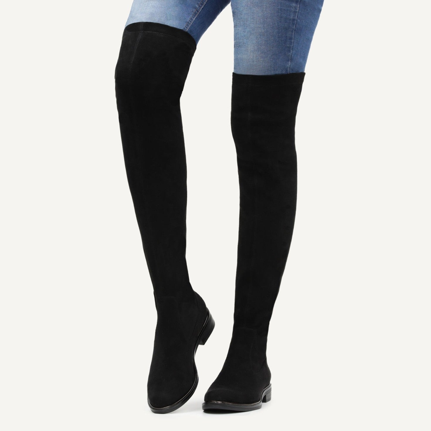 Caprice over the knee vegan boot worn with blue jeans