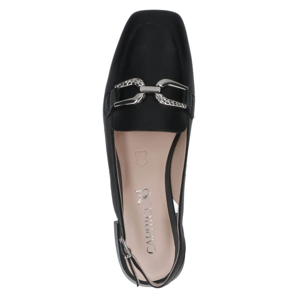 Black flat shoe with a silver buckle on a white background