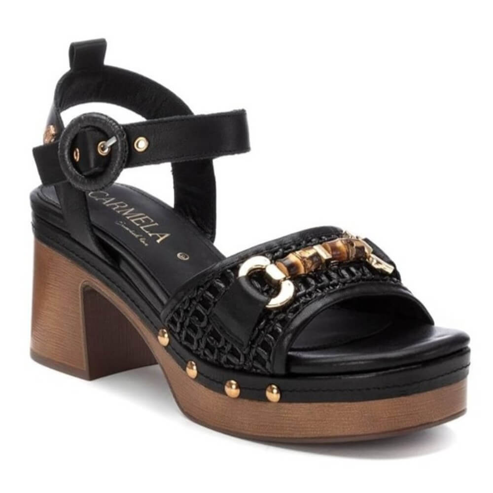 Carmela Black sandal with wooden effect platform and gold accents on a white background