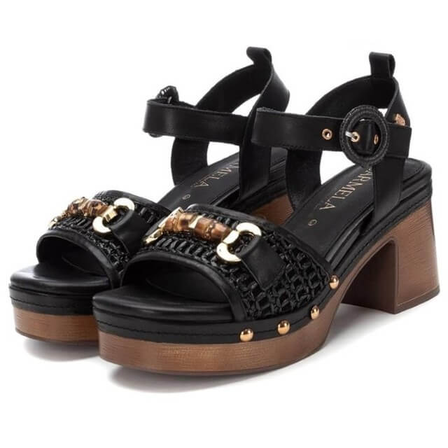 Carmela Black sandals with wooden effect platform and gold accents on a white background