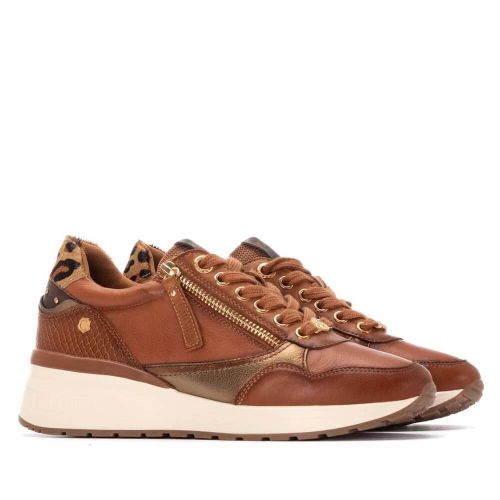 Carmela Brown sneakers with gold accents on a white background