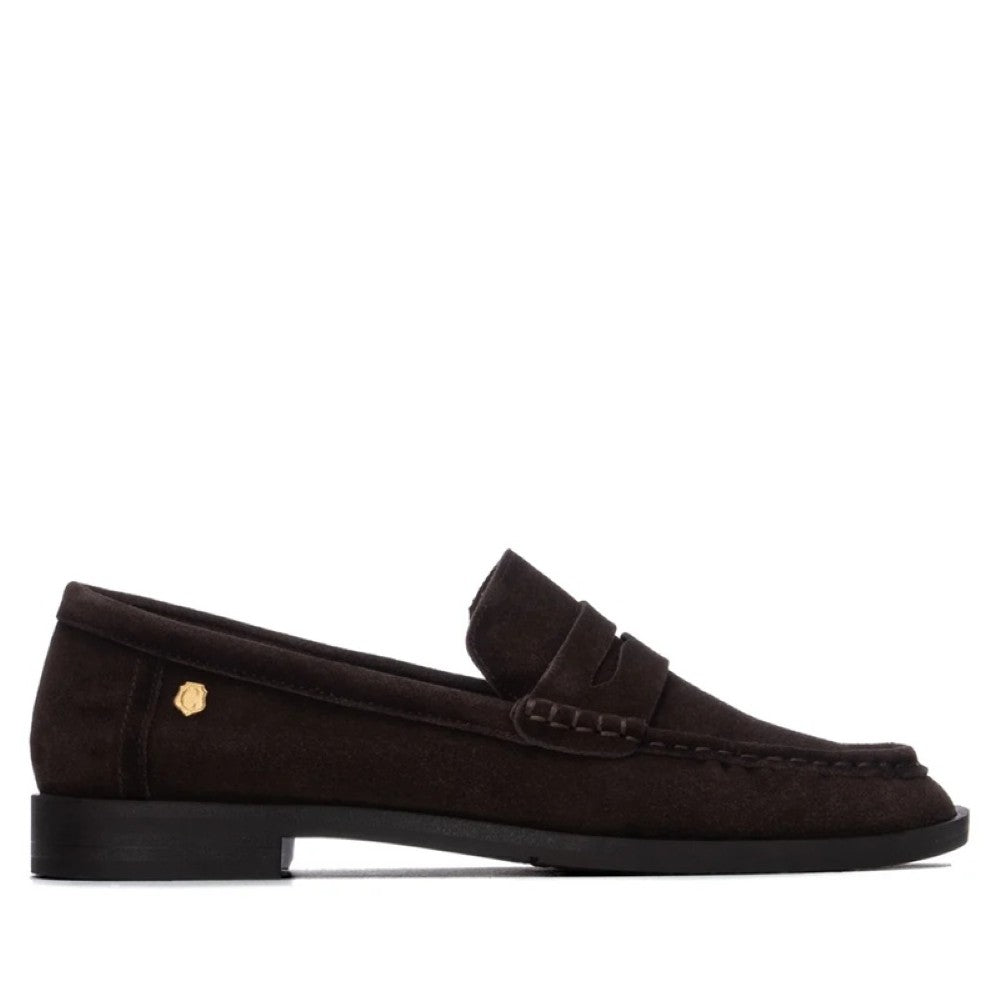A Carmela dark brown suede penny loafer shown in a side profile view against a solid white background.