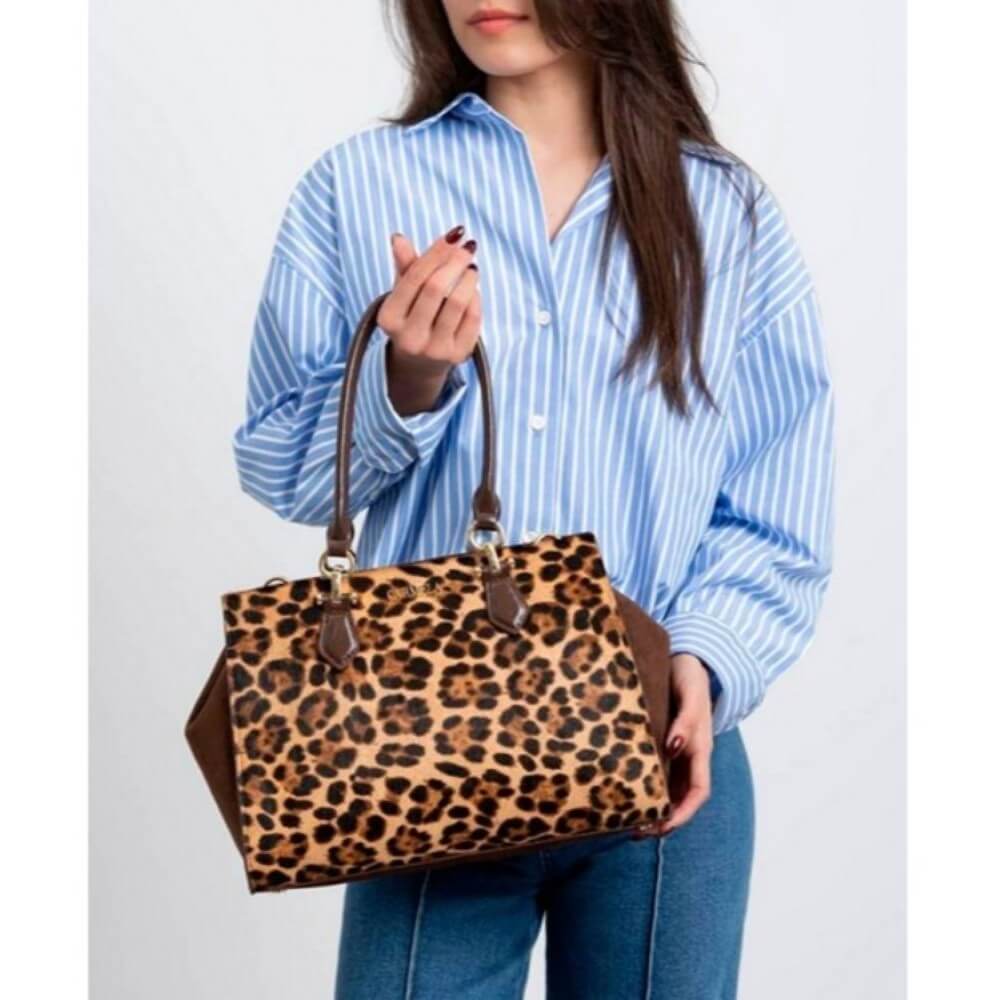 Person Holding a Leopard print shoulder bag