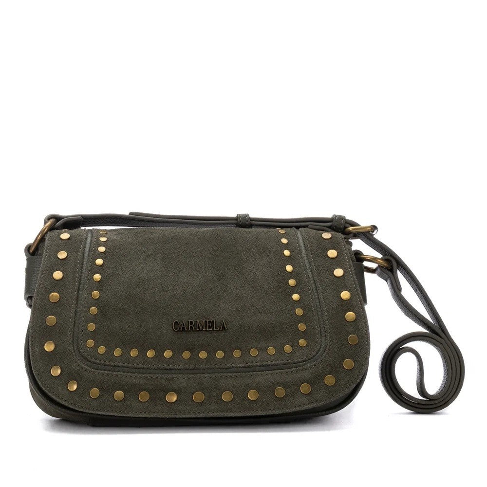 An olive green suede crossbody bag with gold-tone metal studs and a black leather strap, featuring the brand name 'CARMELA' on the front flap.