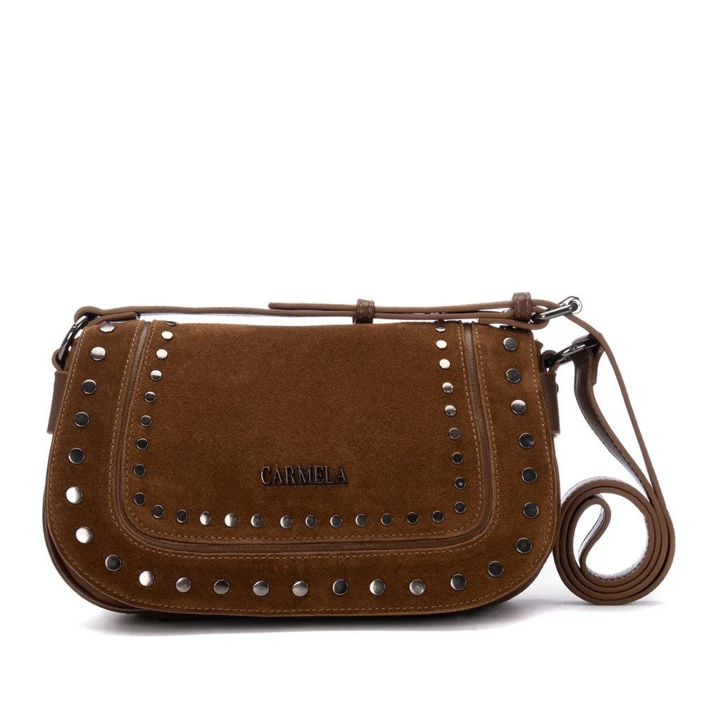 A brown suede crossbody bag with silver-tone metal studs and the brand name 'CARMELA' embossed on the front, shown against a plain white background.
