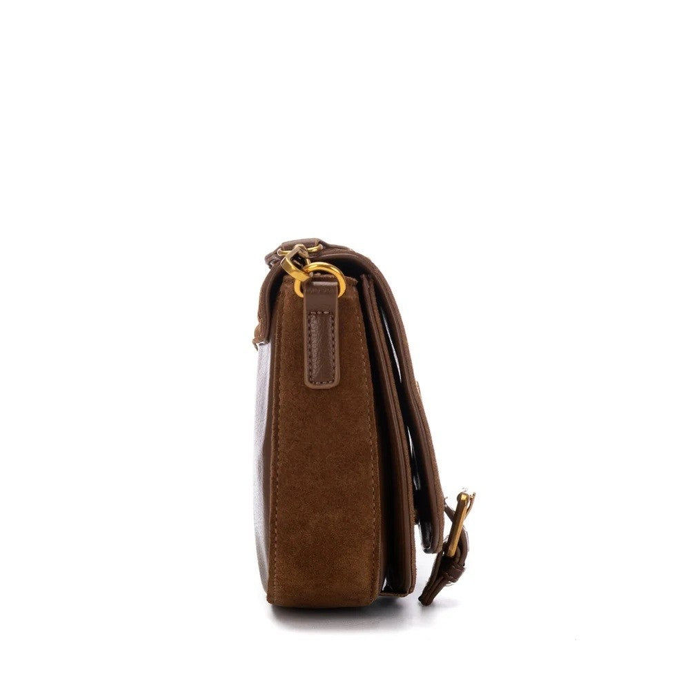 A brown suede and leather crossbody bag shown from a side profile view against a plain white background.