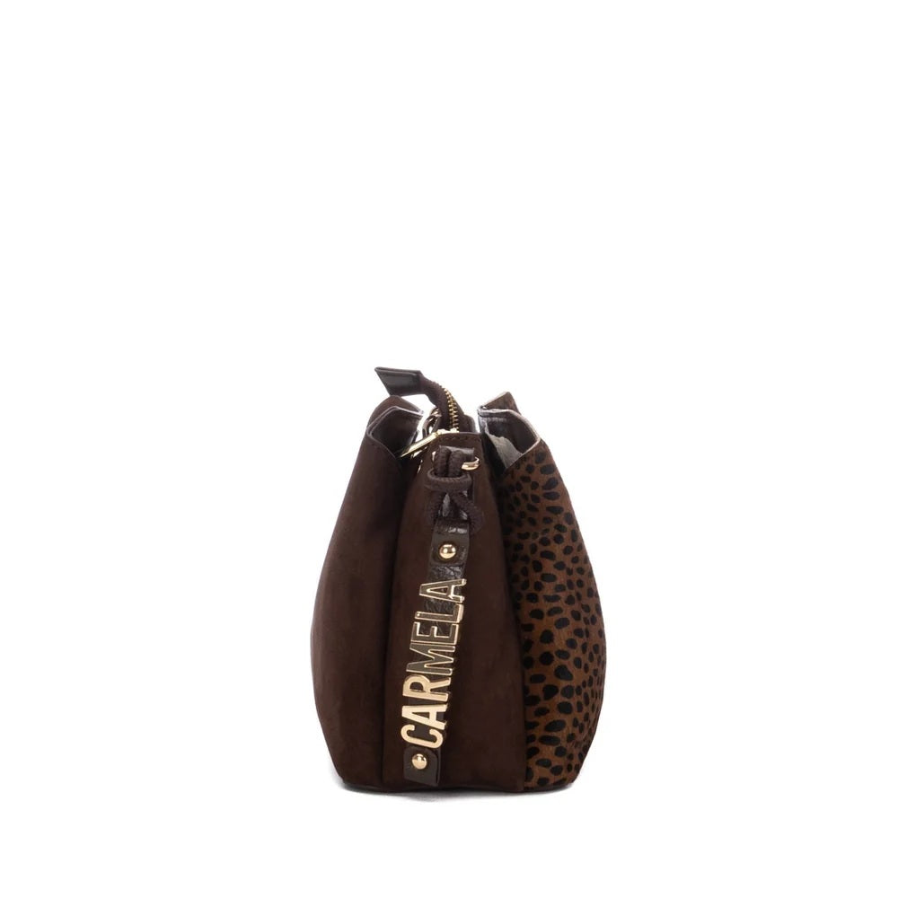 A Carmela dark brown handbag with a mix of smooth suede-like material and leopard print fabric, featuring a vertical gold-tone metal plate with the brand name 'CARMELA' in gold lettering.