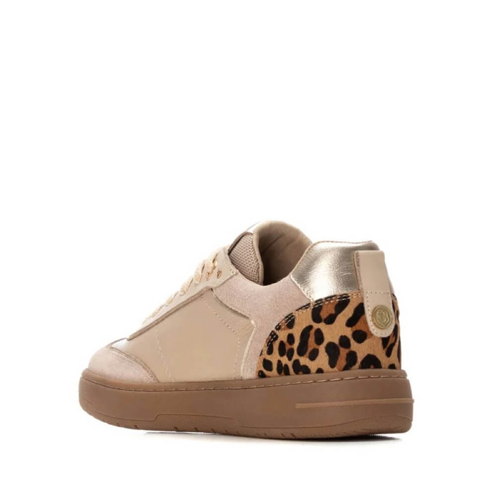 Beige sneaker with leopard print accent on a white background