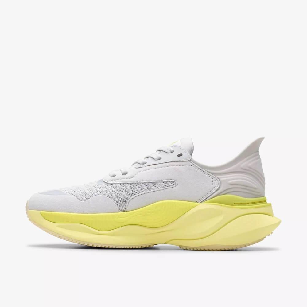 Clarks White Walking shoe with a yellow sole on a white background