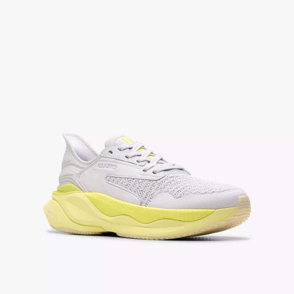 Clarks White Walking shoe with a yellow sole on a white background