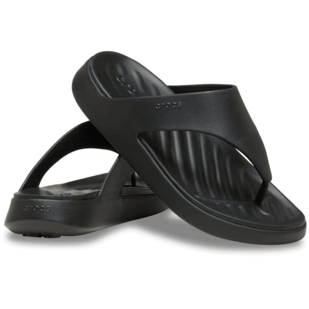 Black sandals with 'Crocs' branding on a white background