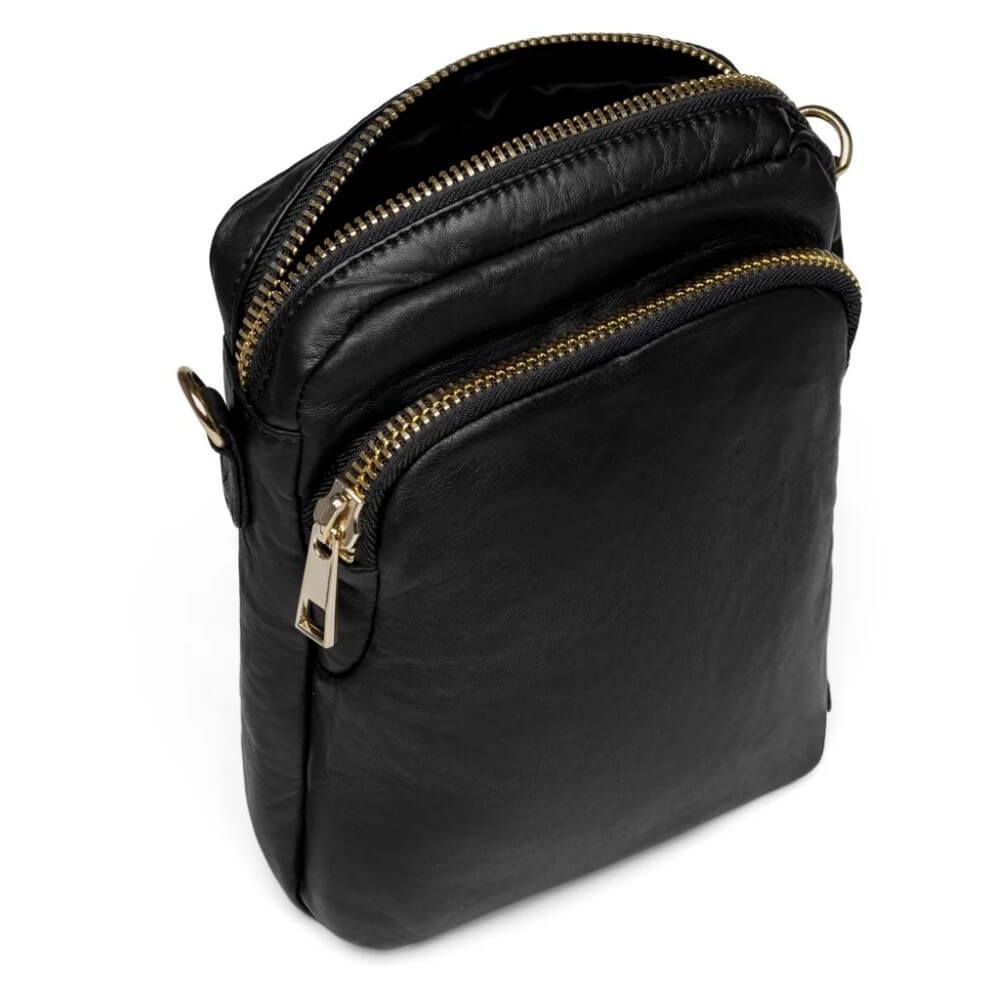 Depeche Black leather crossbody bag with gold zippers on a white background