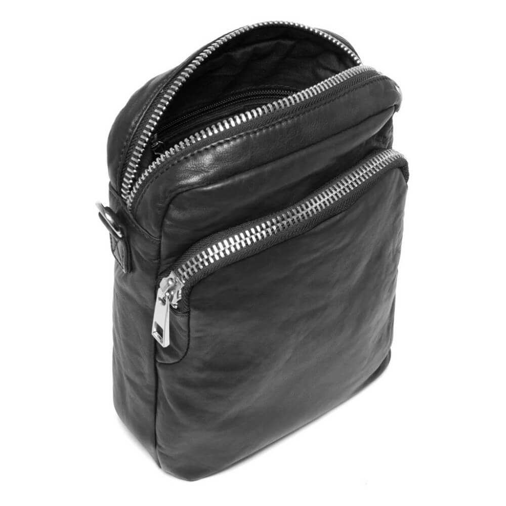 Depeche Black leather crossbody bag with gold zippers on a white background