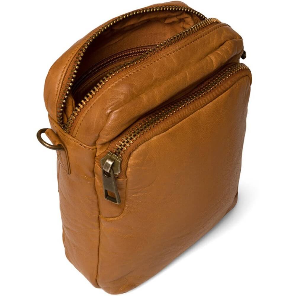 Depeche Brown leather bag with zippers on a white background