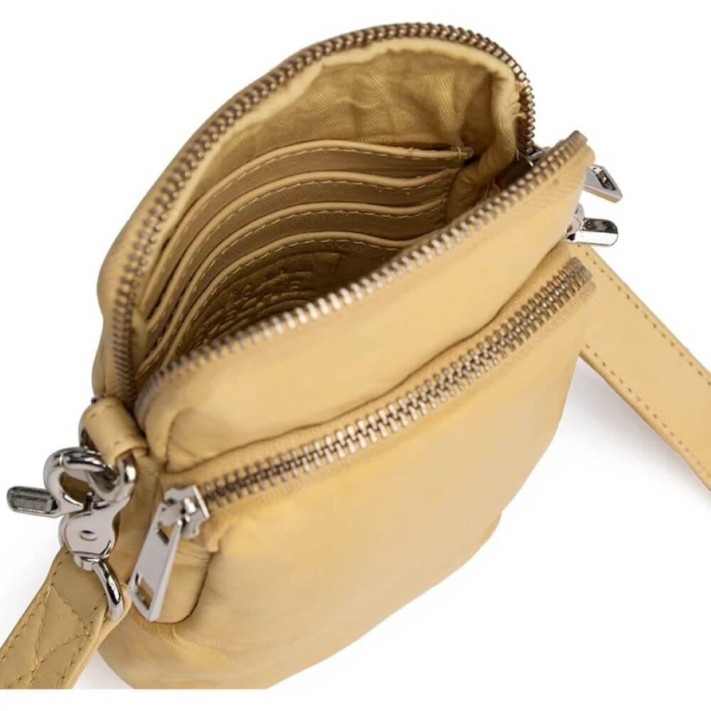 Depeche Yellow Leather crossbody bag with multiple zippers on a white background