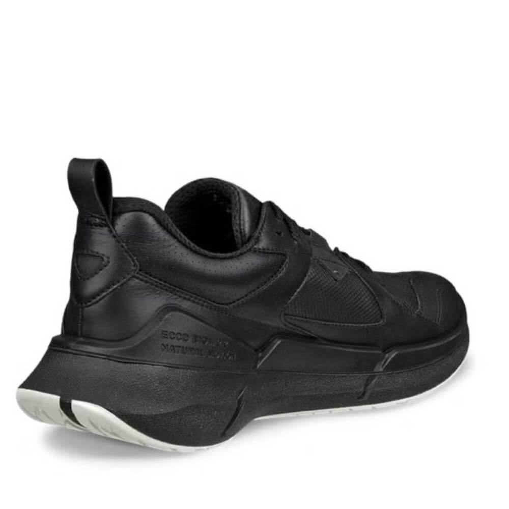 Black sneaker with brand logo on a white background