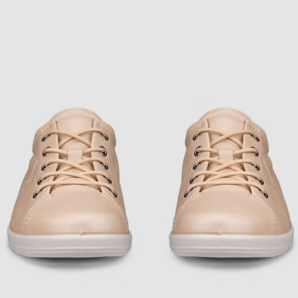 Pair of ECCO beige sneakers on a light gray background