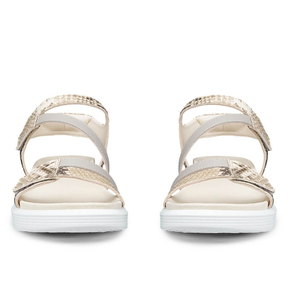 Pair of Ecco Beige sandals with snake print straps on a white background