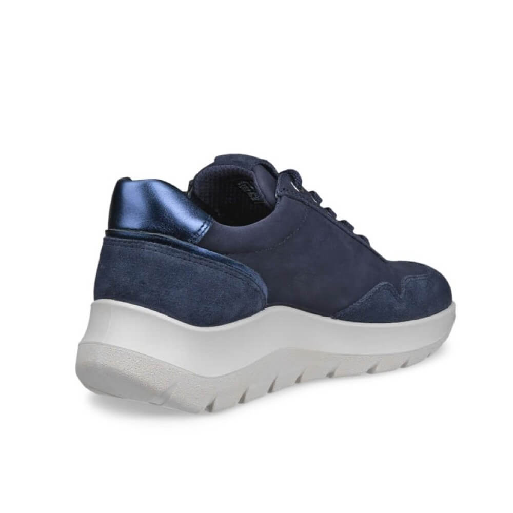 Ecco navy blue low-top sneaker with a textured suede upper, matching navy laces, and a thick white platform sole, shown from a three-quarters rear angle on a white background.