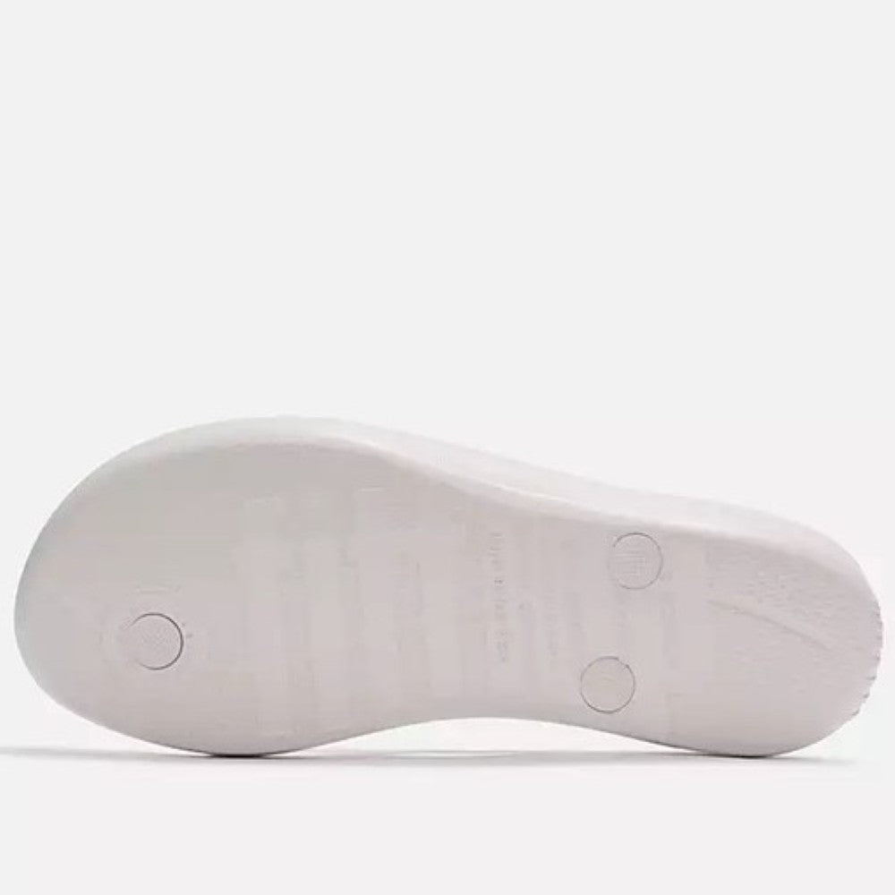 Fitflop White sandal with a decorative strap on a white background