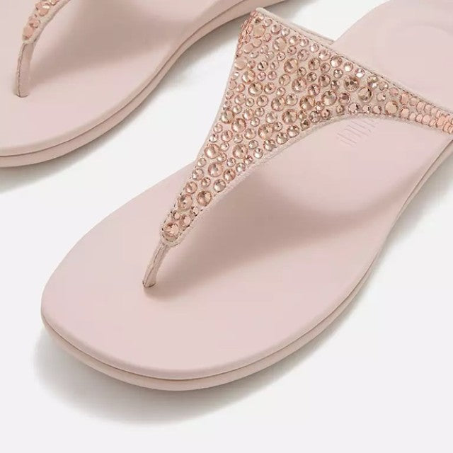 fitflop nude rose sandal with decorative straps on a white background