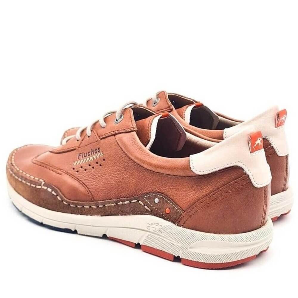 Fluchos Brown leather shoe with white sole on a white background
