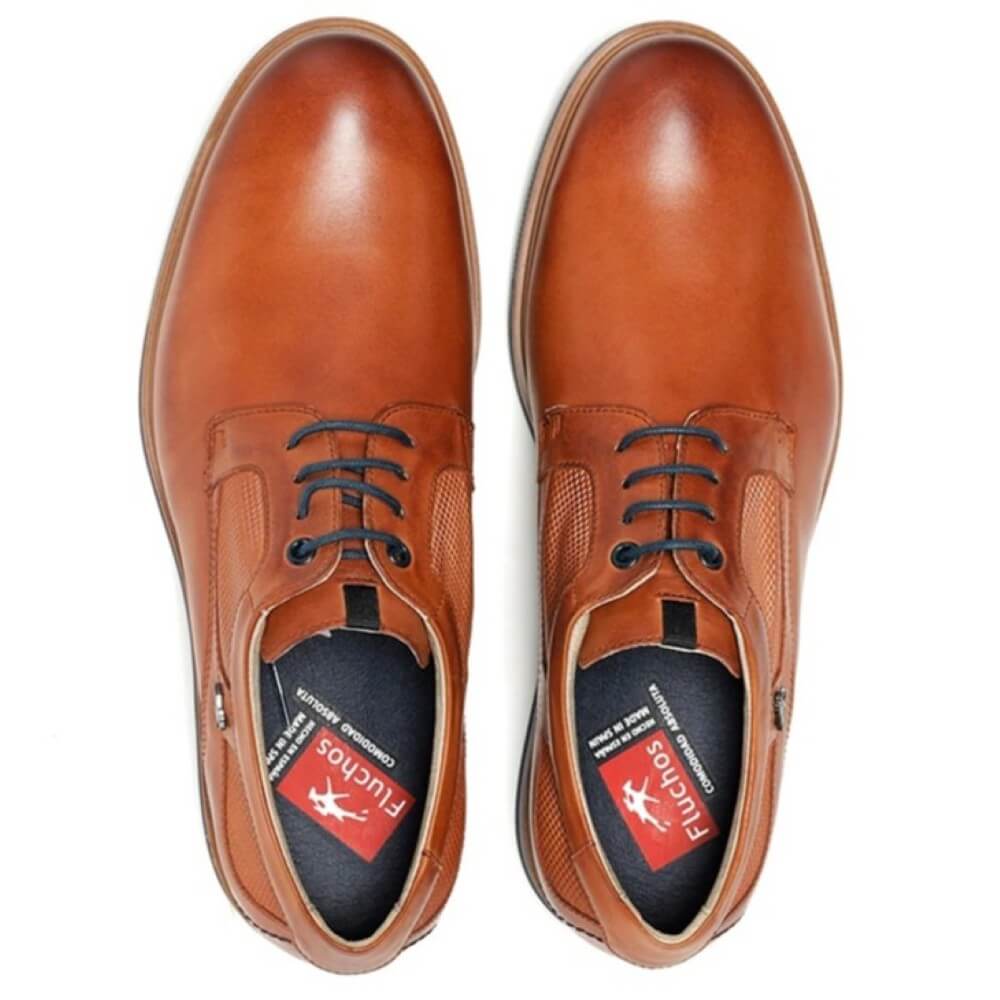 Pair of Fluchos brown leather shoes with black laces on a white background