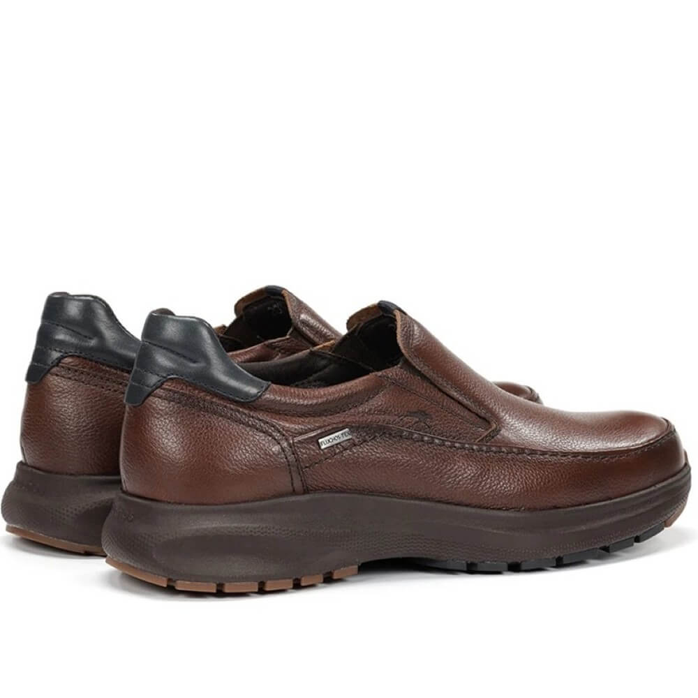 Brown slip-on shoe with black sole on a white background, featuring a waterproof label. Fluchos Triton F2064 Waterproof Leather Slip-on Nut Brown