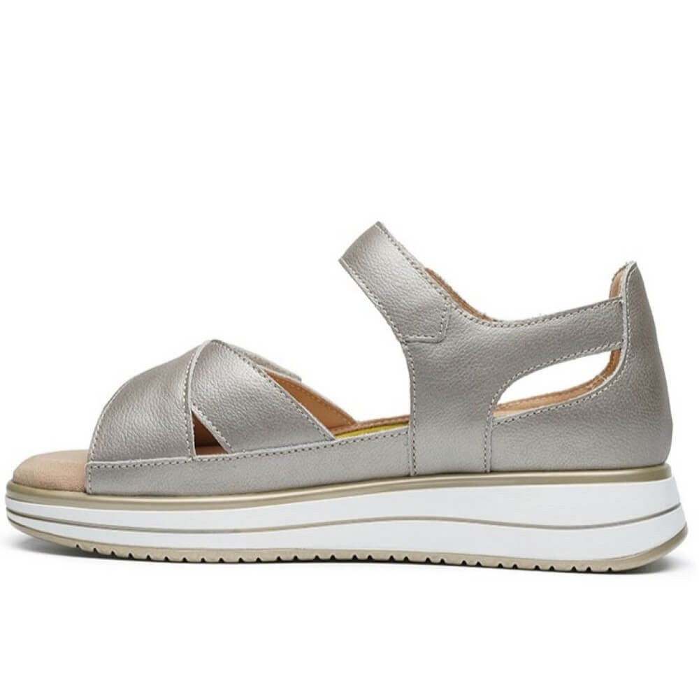 G Comfort Gold sandal with a white sole on a white background