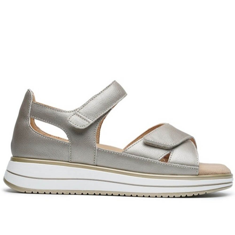 G Comfort Gold sandal with a white sole on a white background