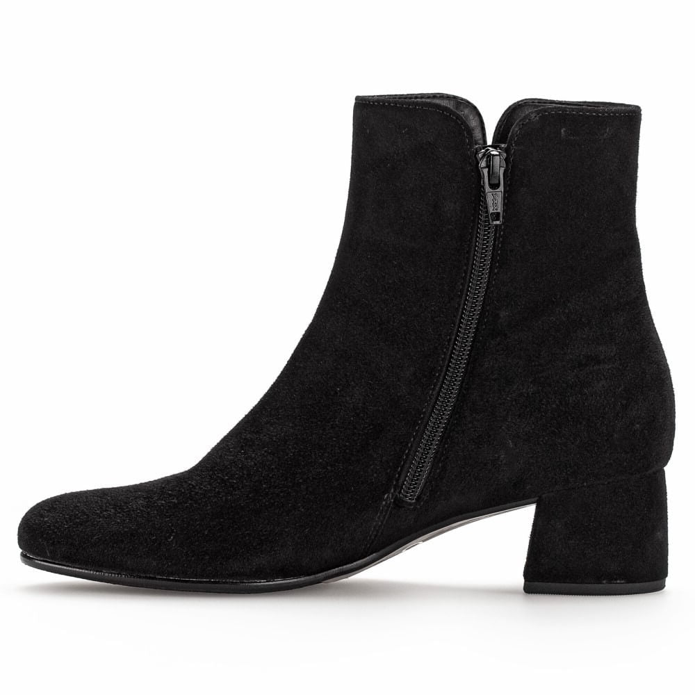 A Gabor black suede ankle boot with a low block heel and a side zipper, shown in profile against a white background.