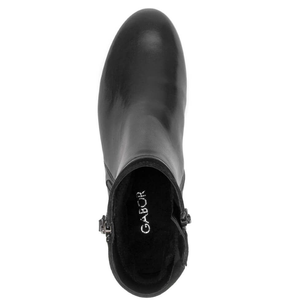 A black leather ankle boot shown from a top-down view, featuring a side buckle detail and the brand name Gabor '' printed on the black interior lining.