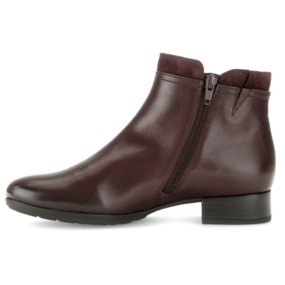 A Gabor dark burgundy leather ankle boot with a side zipper, low block heel, and black sole, shown from a side profile on a white background.