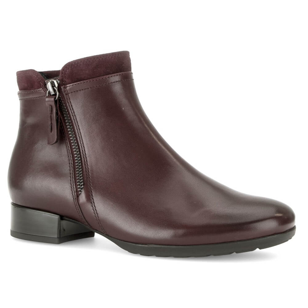 Gabor dark burgundy leather ankle boot with a side zipper, low block heel, and black sole, shown from a three-quarters angle on a white background.
